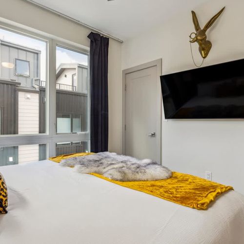 Primary bedroom with flatscreen TV