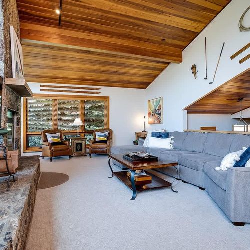 Ample seating in the living area - The wood fireplace is not available for guest use.