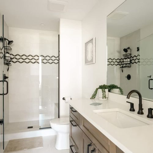 Ensuite primary bathroom with walk-in glass shower