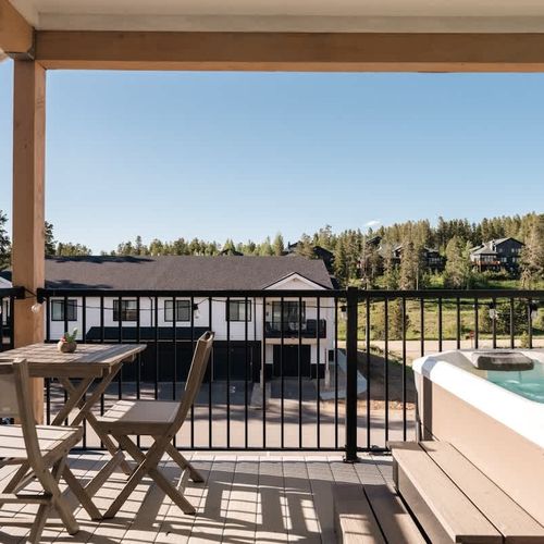 Balcony with seating area and hot tub