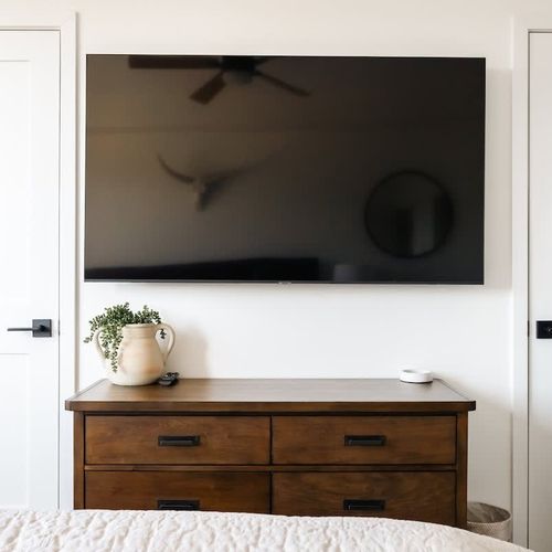 Primary bedroom with flatscreen TV