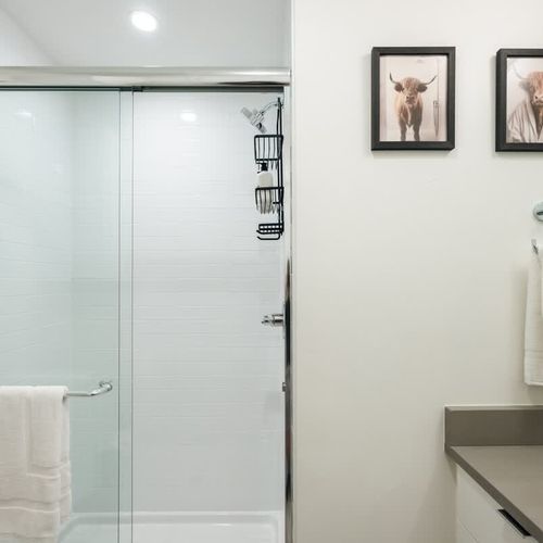 Walk-in glass shower in the primary bathroom
