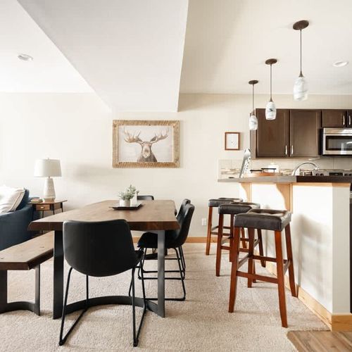 Dining table with additional bar-style seating