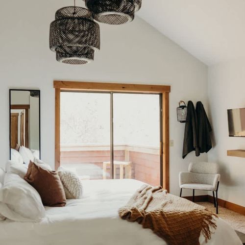 Primary bedroom opening to the second level balcony
