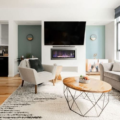 Cozy up by the fireplace in the living room