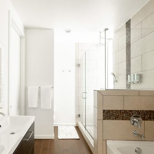 Primary ensuite bathroom with separate tub and shower