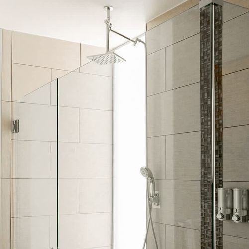 Indulge beneath a rain shower in the primary bathroom