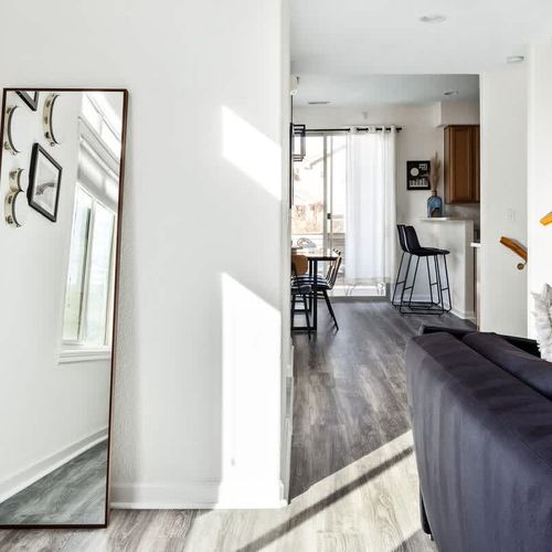 Living area leads to dining area and kitchen