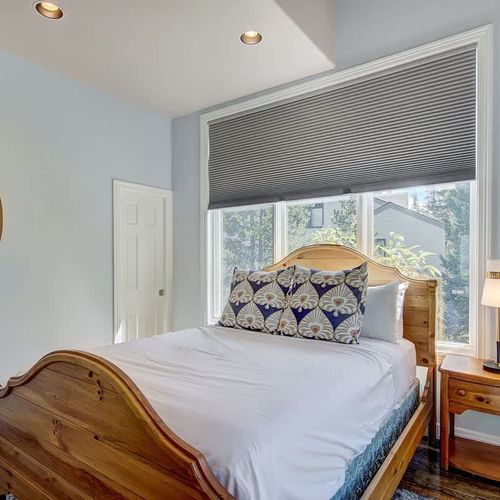 Bedroom 2 with queen bed on main level