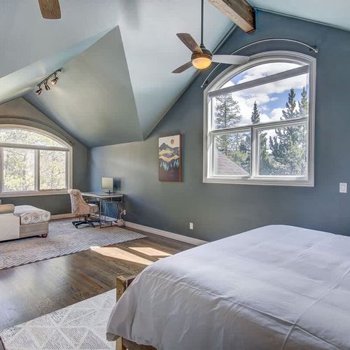 King primary bedroom with workstation and chaise lounge