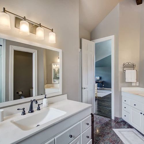 Primary ensuite full bathroom with dual/separate vanities