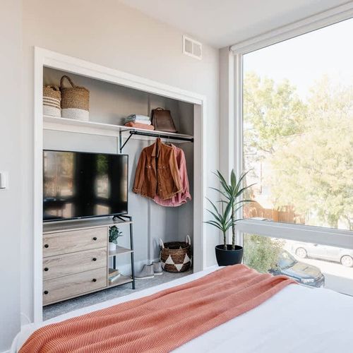 Queen bedroom 2 with TV and storage