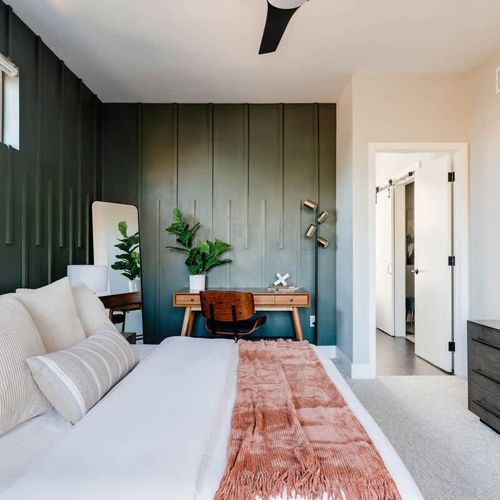 King primary bedroom with ensuite bathroom and work station