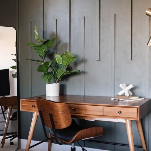 Work station with desk and chair in primary bedroom