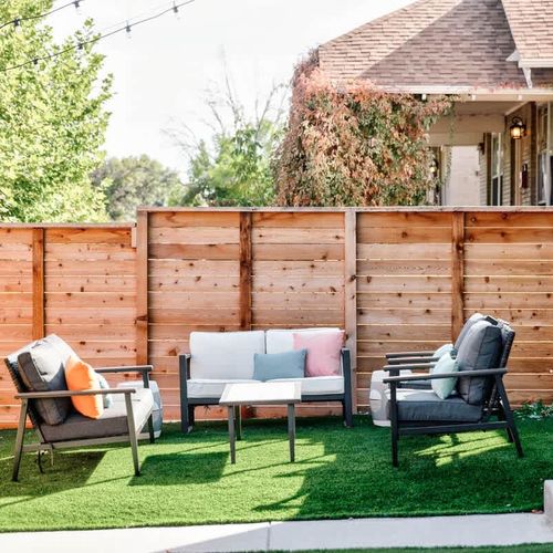 Fenced in side yard with lounge