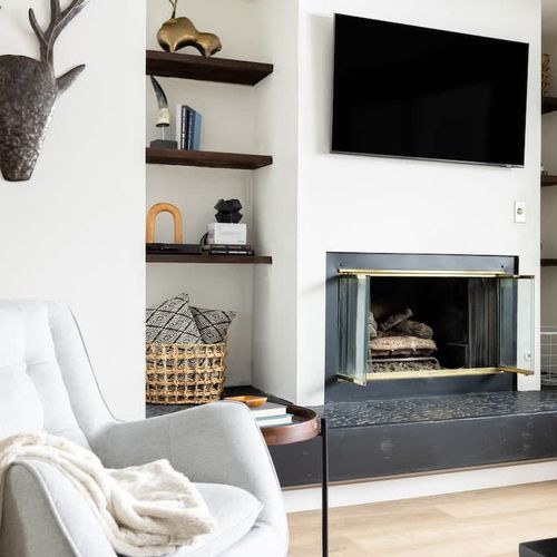 Living area has a gas fireplace and smart TV