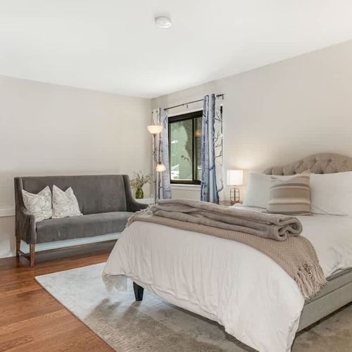 Primary bedroom suite with queen bed