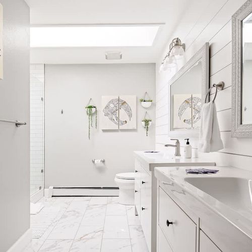 Large en suite bathroom with skylight