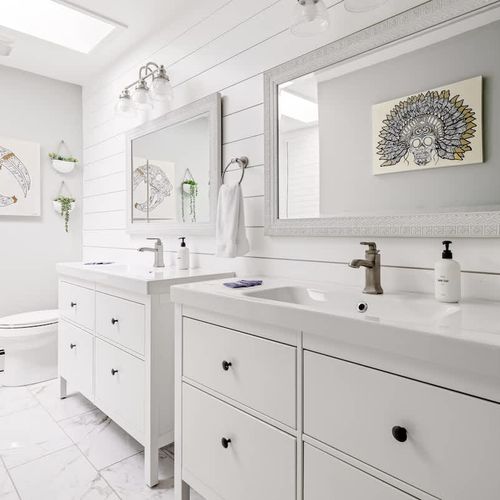 There are two vanities in the primary en suite bathroom