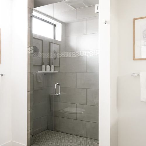 Walk-in glass shower in the primary bathroom