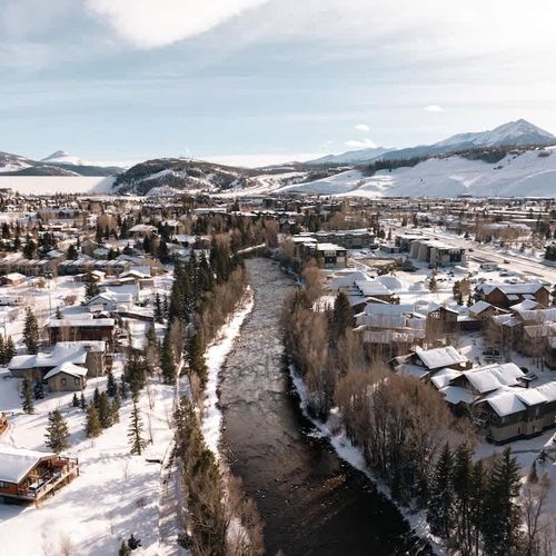 Overhead view the unit and Blue River, showing 'Big Red' (Red Mountains) in the background