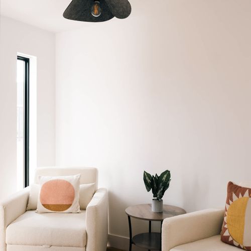 Entry room with two chairs that convert to twin beds