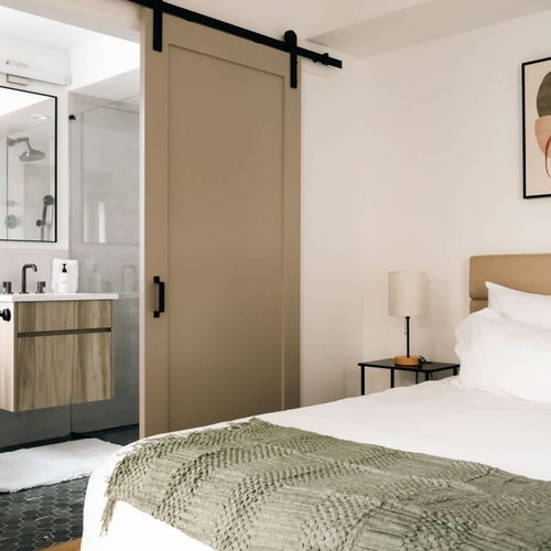 Bedroom 2 with king bed and en suite bathroom