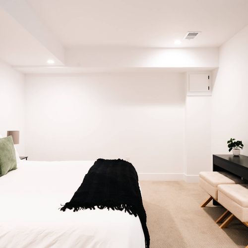 Bedroom 4 in basement with king bed