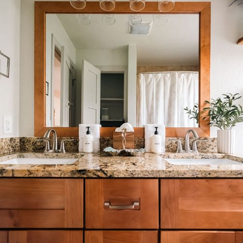 Hallway bathroom with dual vanity