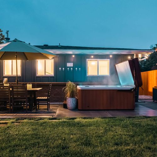 Backyard oasis with seating, hot tub, cold plunge, and sauna