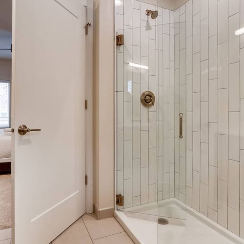 The attached master bathroom has a fantastic shower.