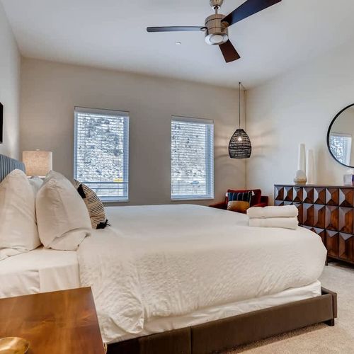 The master bedroom is modern with a generous dash of sunshine.