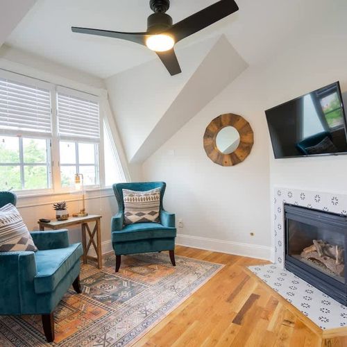 The room has its own seating area and fireplace.