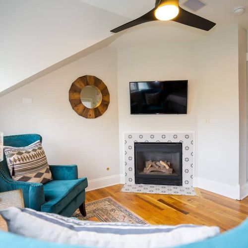 The room has its own seating area and fireplace.