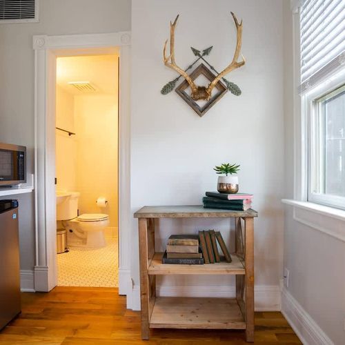 The room includes a microwave and mini fridge.