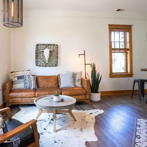 The living area is a comfortable, stylish area that includes a couch, and chair.
(The fireplace is currently out of order and not available for use.)