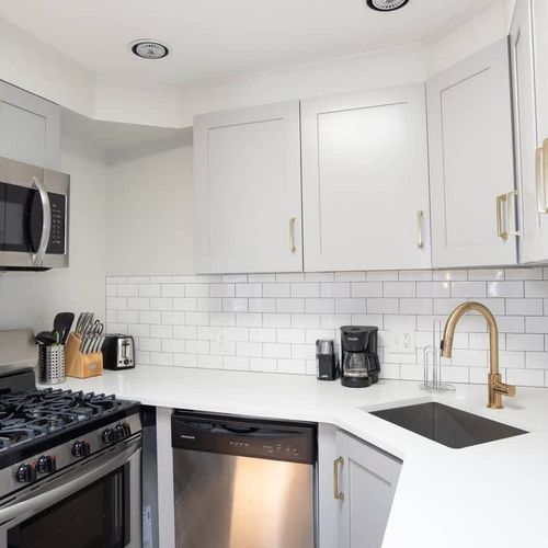 The kitchen is fully stoked with every utensil and appliance one would need to make a home cooked meal.
