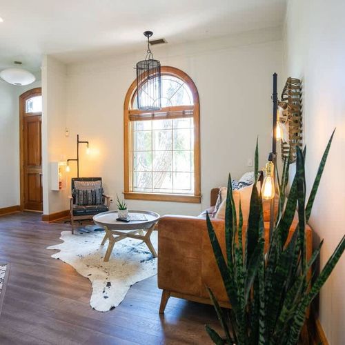 The living area is a comfortable, stylish area that includes a couch and chair.
(The fireplace is currently out of order and not available for use.)