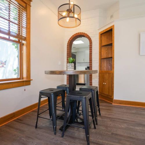 Next to the living area, guests will find a quaint dining table, ideal for four guests.