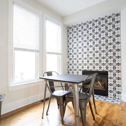 Guests can use the bistro set to enjoy a breakfast by the fireplace.