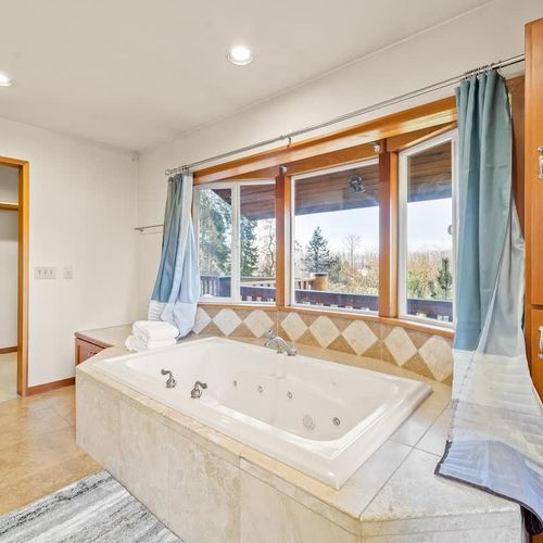 Primary bathroom with separate tub and shower