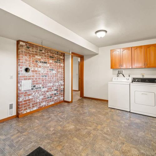2 of 2 laundry rooms at the house, this one located in the basement.