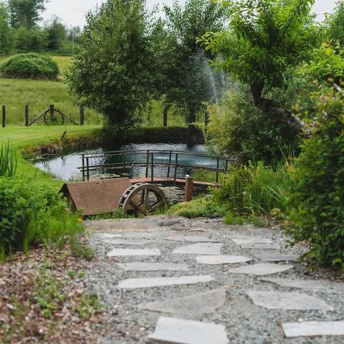 The pond on the property is just at the end of the driveway.