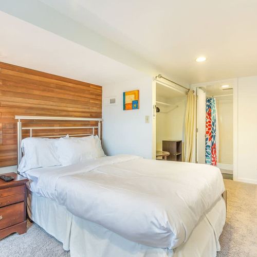 Downstairs bedroom with a full size bed.