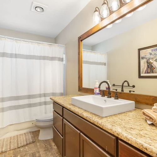 The first floor has a full bathroom, right outside the bedrooms.