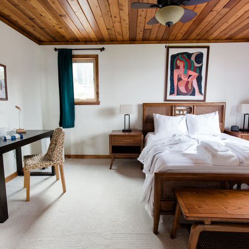 Primary bedroom with Queen bed, luxury bed linens and comfy robes.