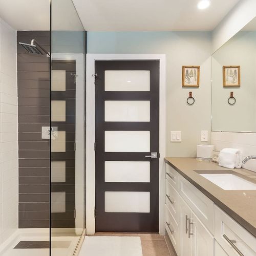 Step into our master bathroom's stand-up shower for a revitalizing start or a soothing end to your day.