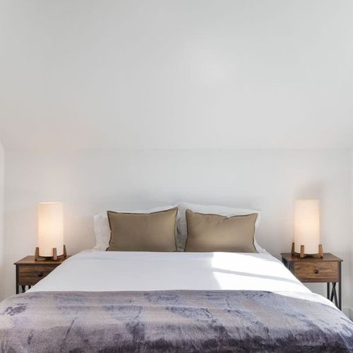 The main bedroom features a queen sized bed.