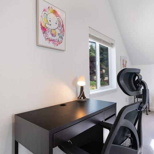 The second bedroom includes a desk, desk chair and futon suitable for 1 person.