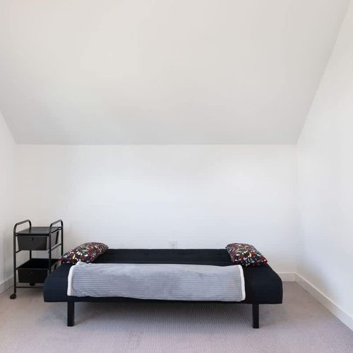 The second bedroom includes a desk, desk chair and futon suitable for 1 person.
